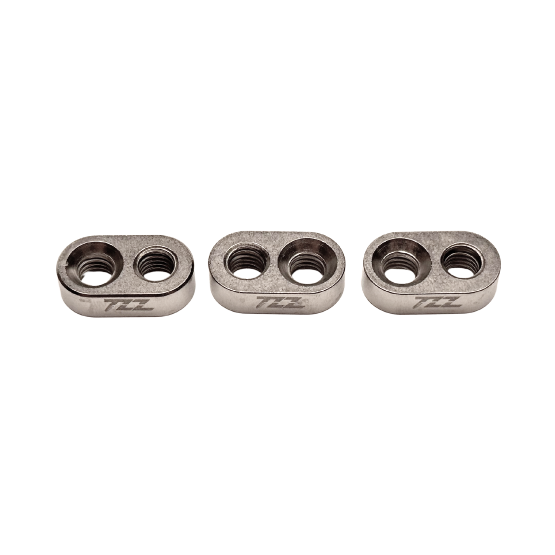 Three metallic components with 'TZZ' branding on a white background