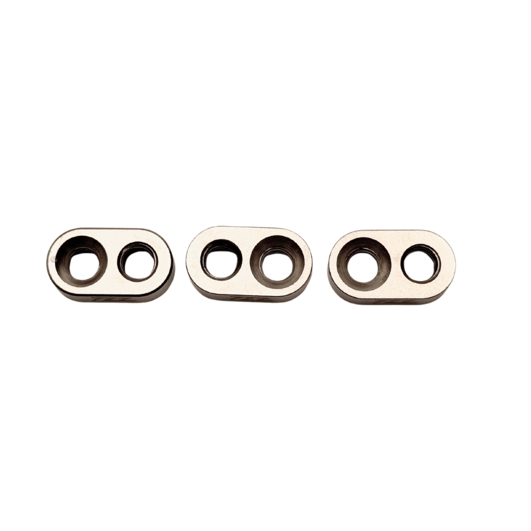 Three metallic rings with three holes on a white background