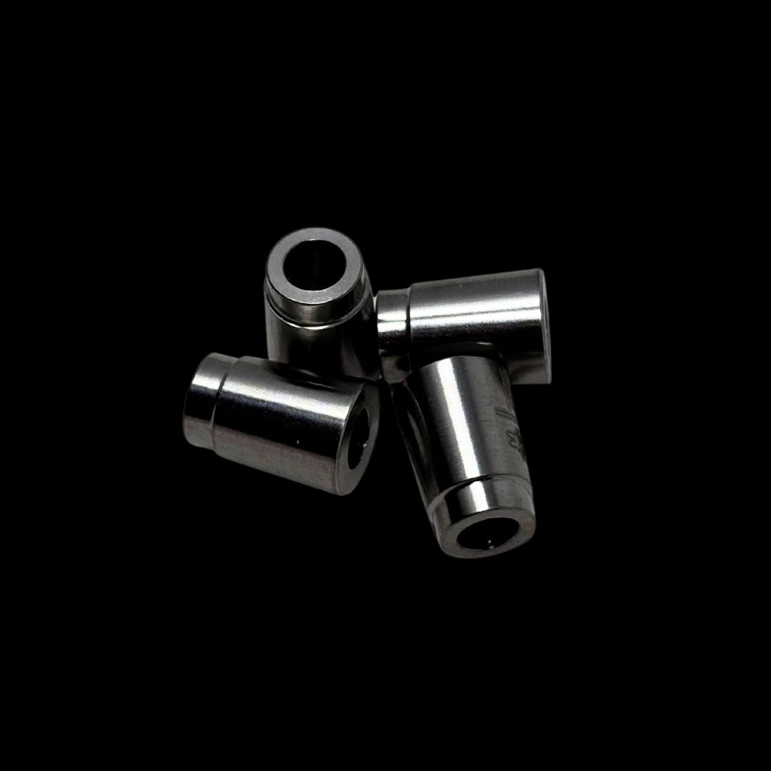 Metallic cone shaped spacers against a black background