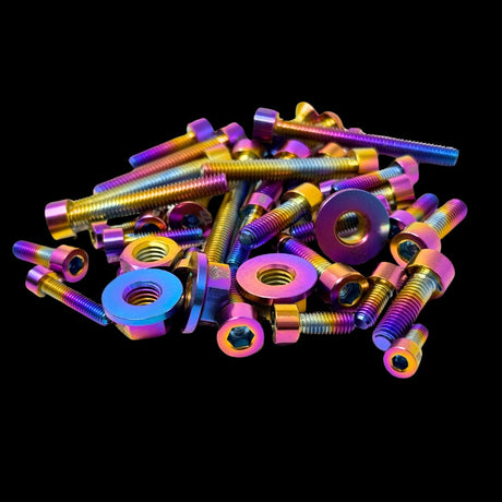A set of multicolored titanium alloy screws for a 88cc engine, displayed against a black background.
