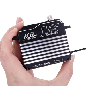 Hand holding a brushless servo with AGT RC branding on a white background