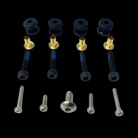 An assortment of RC model vehicle spare hardware including screws and fasteners.