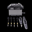 AGFRC Brushless 100KG Billet Servo with various components laid out, predominantly black with metallic and silver accents.