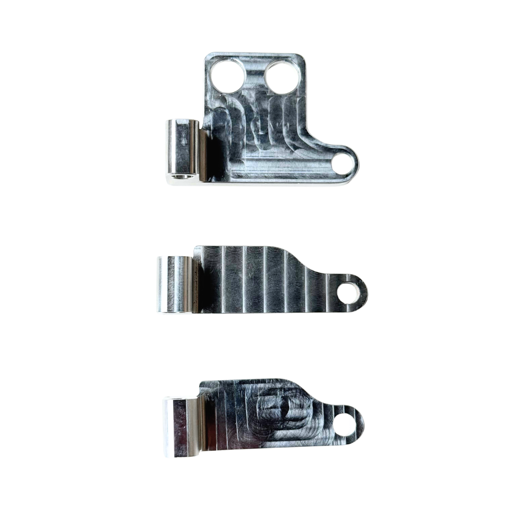 Three metal brackets on a white background
