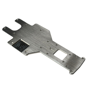 Metallic chassis plate with cutouts on a white background