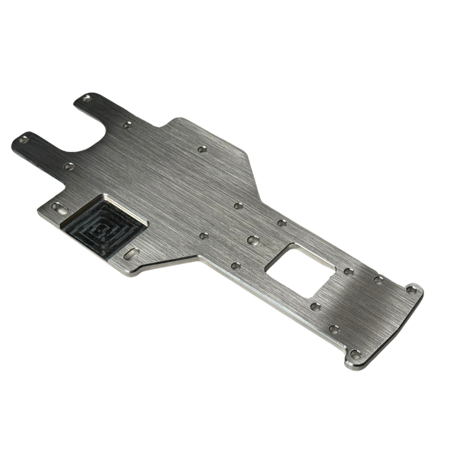 Metallic chassis plate with cutouts on a white background