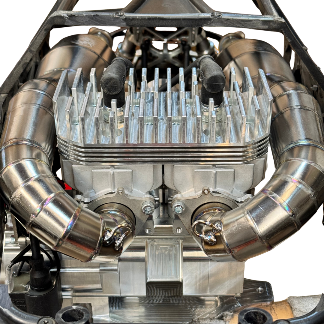 Twin titanium exhaust pipes installed either side of the ALX Twin heatsink in a Baja chassis