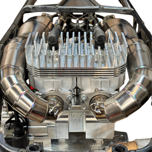 Twin titanium exhaust pipes installed either side of the ALX Twin heatsink in a Baja chassis