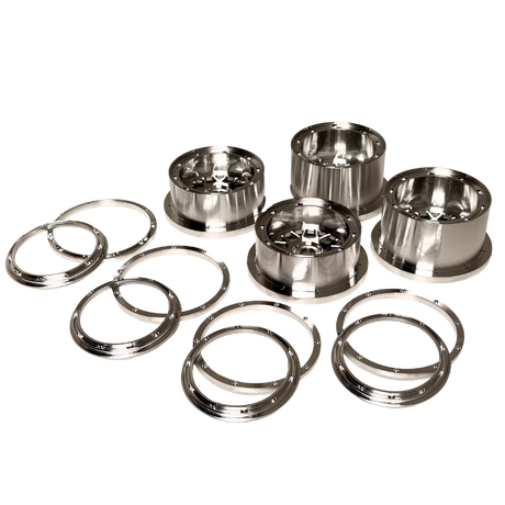 Beast RC Baja 5B complete billet wheel set with 8-piece beadlocks, angled view showing the narrower front wheels with hidden-bolt beadlock rings
