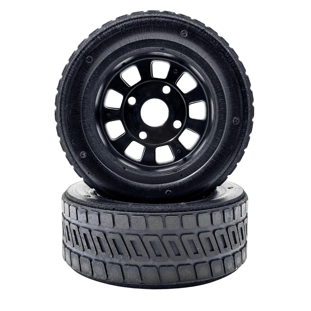 Two black tires with tread patterns on a white background