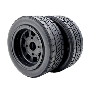 Black tire with tread pattern on a white background