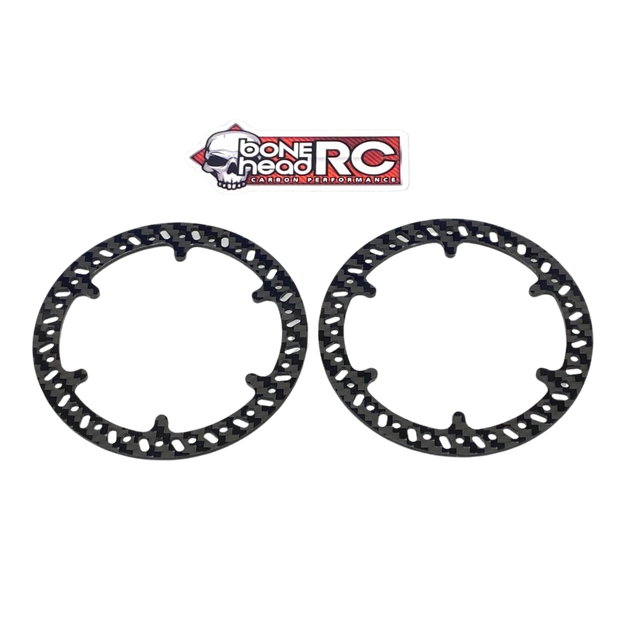 Two black carbon fiber discs with 'Bonehead RC' logo on a white background