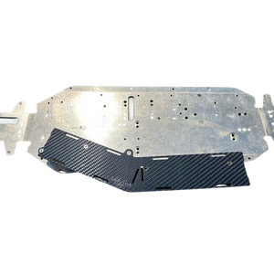 Metal and carbon fiber car underbody protection panel on a white background