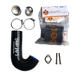 Collection of car parts including a black silicone hose, metal clamps, and packaging on a white background.