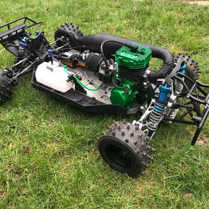 Model off-road vehicle with green engine on grass