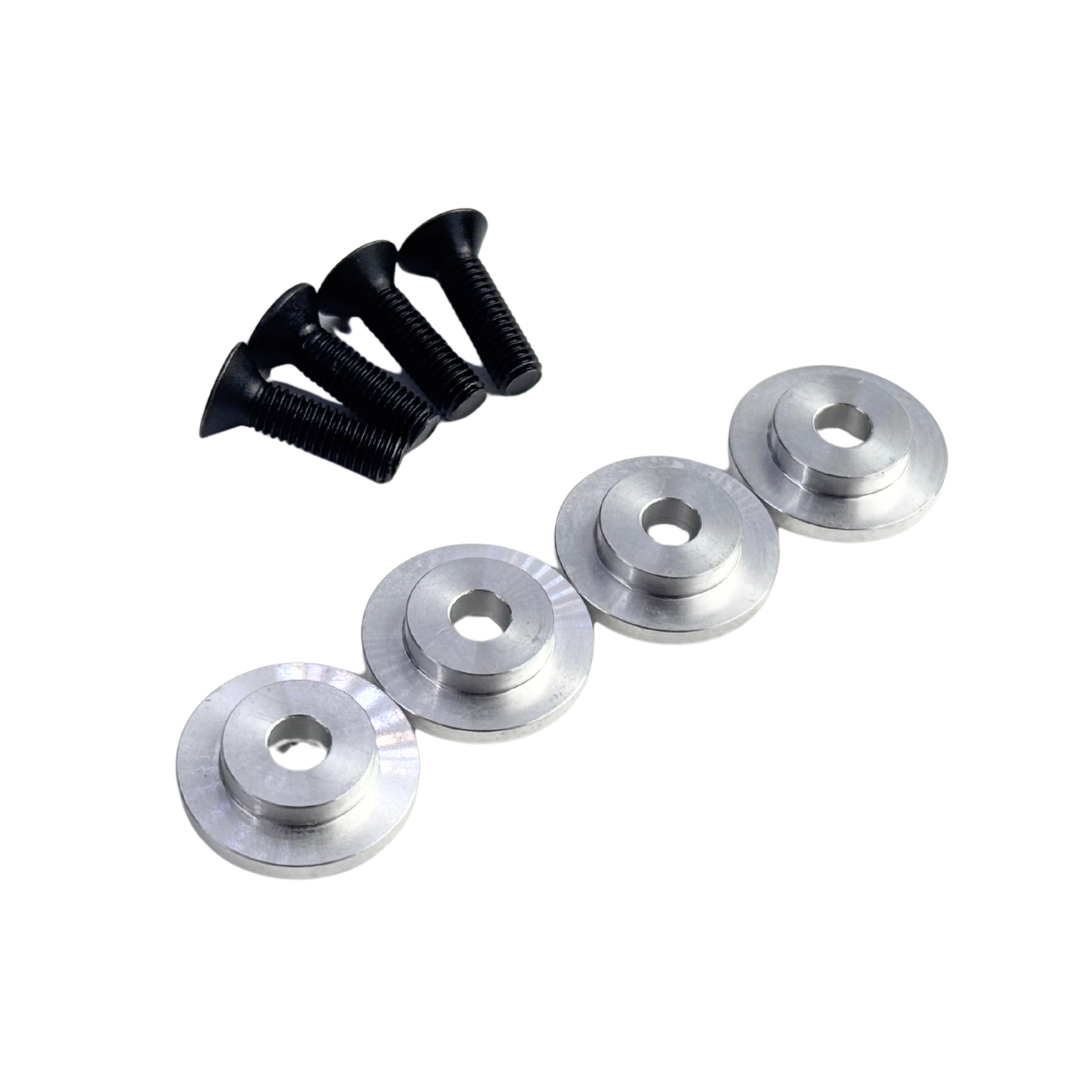Set of four silver metal washers and three black screws on a white background