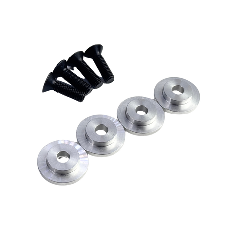 Set of four silver metal washers and three black screws on a white background