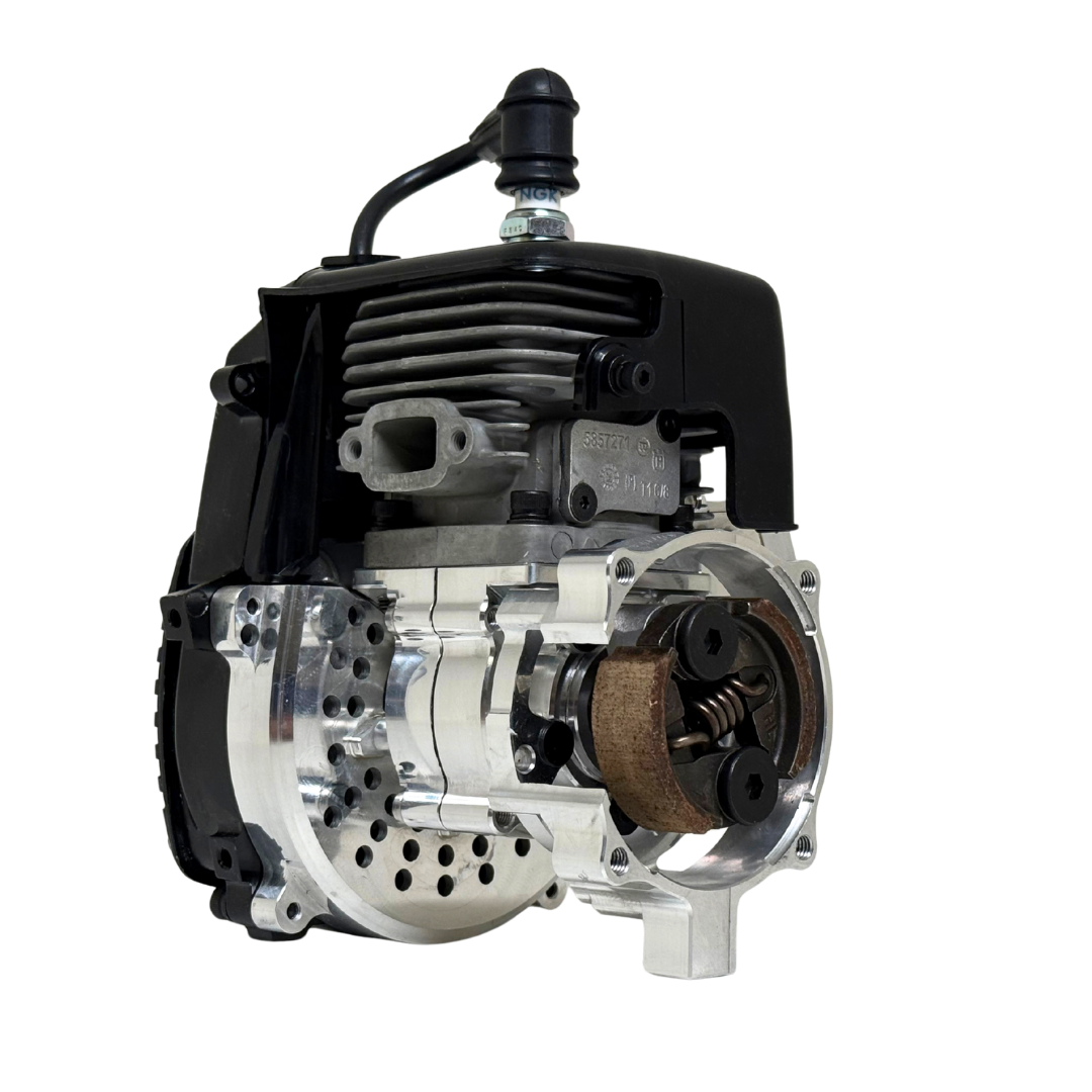 Front view of the HPRC 32cc race ported Zenoah engine showing the raw silver billet clutch bell housing with exposed clutch shoes and cooling vent holes