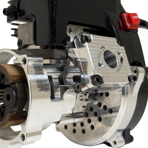 Close-up of the HPRC 38cc race ported Fujiwara engine's raw silver clutch mechanism, showing the clutch shoe, spring and billet mounting plate