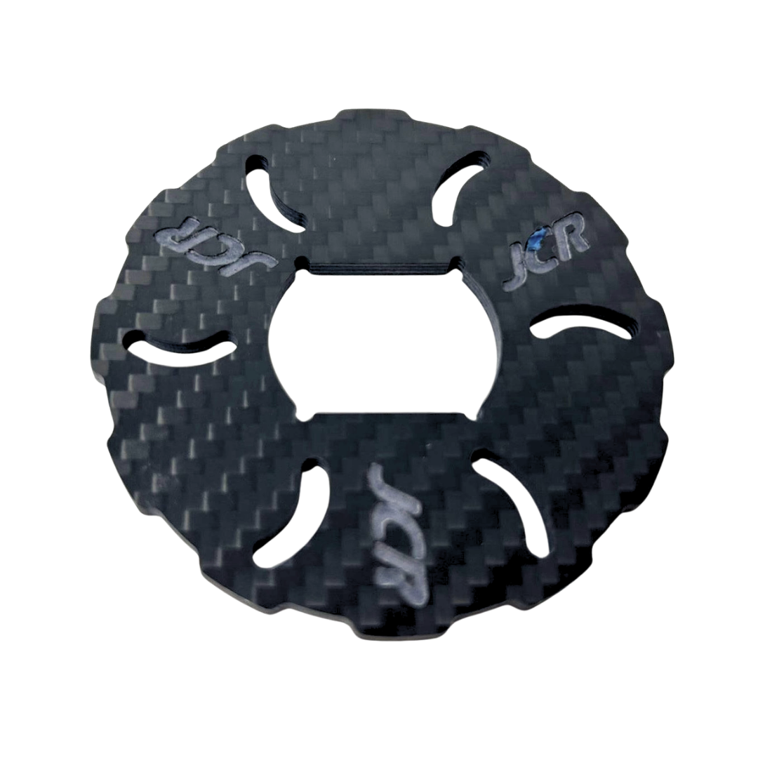 Carbon fiber texture disc with 'JCR' branding on a white background