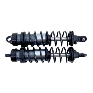 Two shock absorbers on a white background