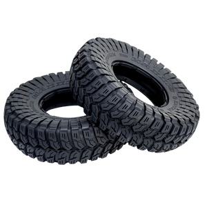 Two black off-road tires with tread pattern on a white background