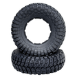 Two black off-road tires with tread pattern on a white background