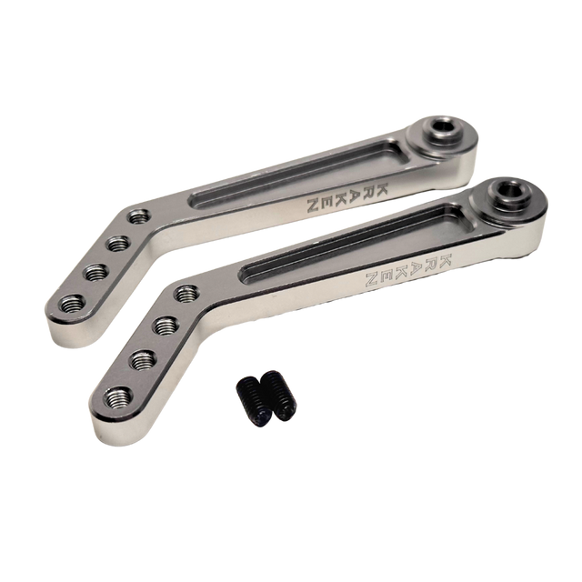 Two metal brackets with screws on a white background