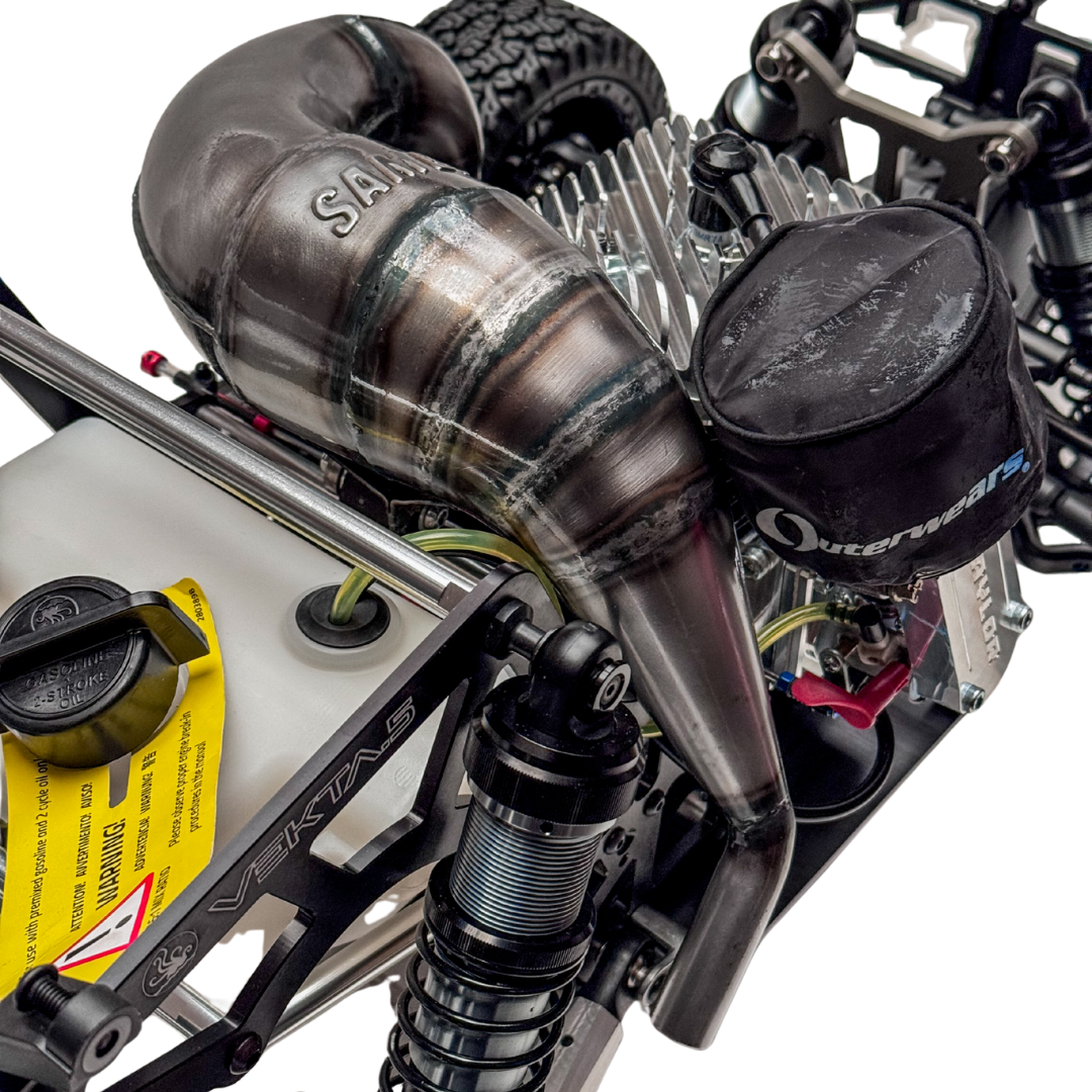 Close-up of a detailed model engine with visible branding on a white background