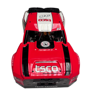 Red and black model car with visible branding on a white background