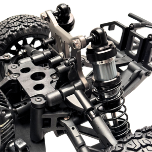Close-up of a detailed metal suspension system on a model vehicle