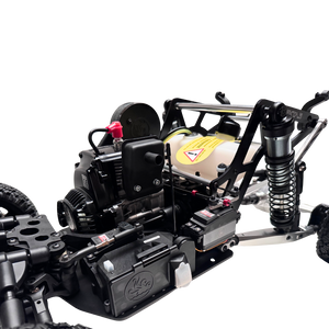 Close-up of a black off-road vehicle chassis with visible components on a white background