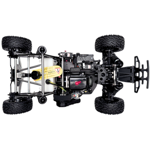Black off-road vehicle chassis with suspension and tires on a white background