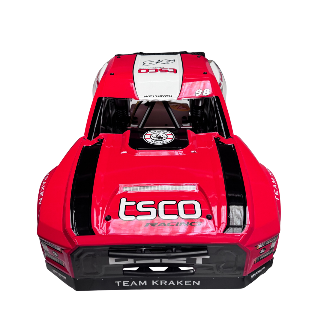 Red and black model car with 'tsco' and 'Team Kraken' branding on a white background