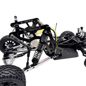 Close-up of a mechanical model with 'Vekta' branding on a white background