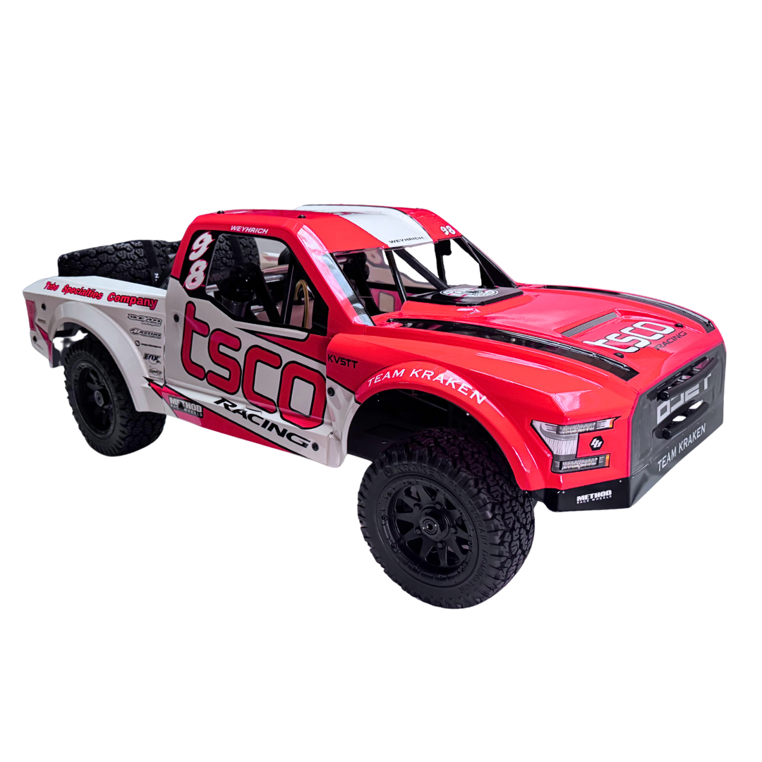 Red and white off-road truck model with 'TSCO Racing' branding on a white background