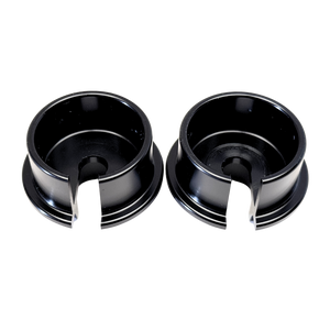 Two black metal bushings on a white background