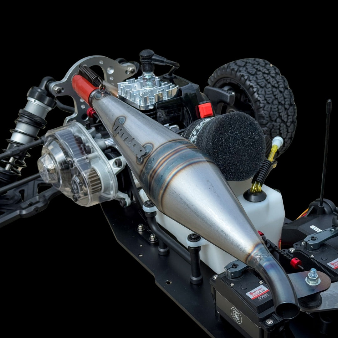 Close-up of a model car with detailed components on a black background