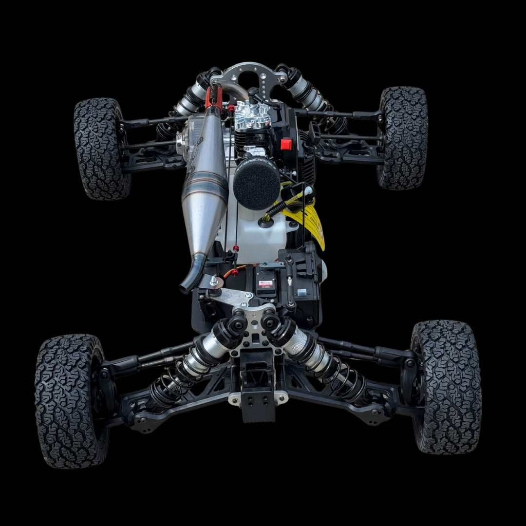 Top-down view of a remote control car chassis on a black background