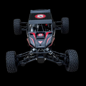Top-down view of a black and red off-road VESLA chassis with visible branding on a transparent background.