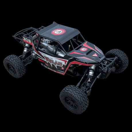Black and red remote control off-road vehicle on a black background