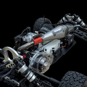 Close-up of a detailed model car chassis with visible branding on a black background