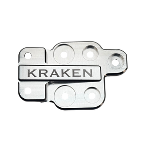 Metal component with 'Kraken' branding on a white background