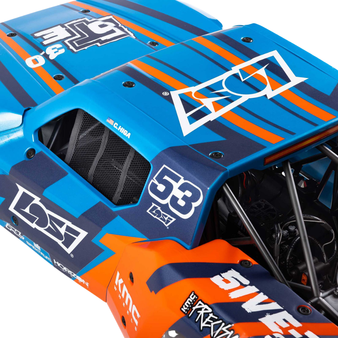 Close-up of a blue and orange race car with visible branding on a white background