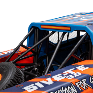 Close-up of a blue and orange off-road vehicle with visible branding.