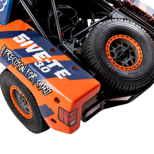 Close-up of a remote control car with '5IVET' branding on an orange and black body.