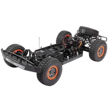 Black off-road vehicle chassis with orange rims on a white background