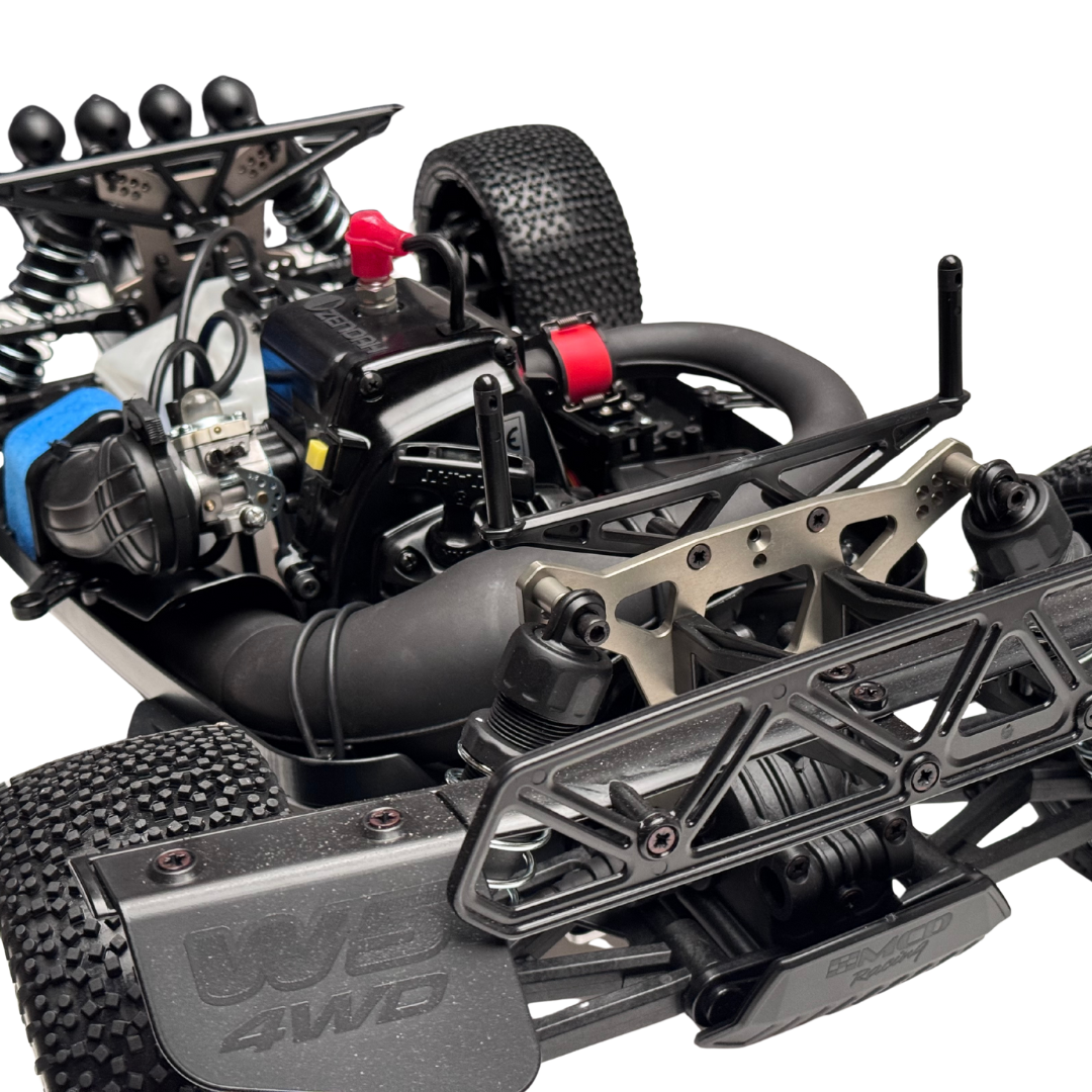 Close-up of a detailed model car chassis with visible branding on a white background