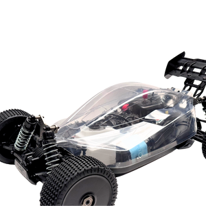 Black and transparent remote control car chassis on a white background