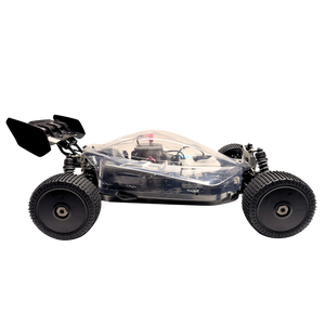 Small remote control car with large wheels on a white background